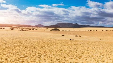 Sand dunes, Las Dunas de Corralejo, Corralejo Natural Park, dramatic cloud .. Stock Photos