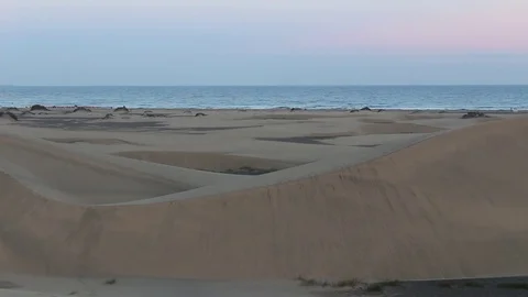Sand dunes of Maspalomas beach overlooking the Atlantic Ocean Stock Footage 74170009