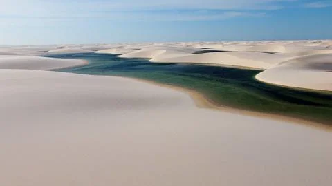 Sand dunes mountains and rain water lagoons at northeast brazilian paradise. Stock-Fotos