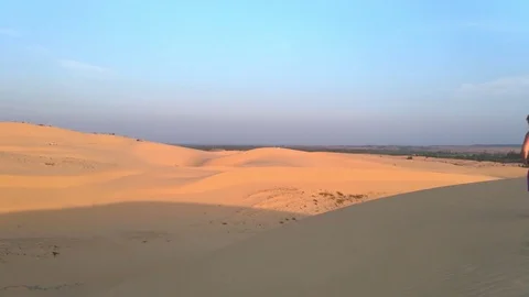 Sand dunes, UHD handheld view of a car driving through white sand dunes, outs Stock Footage 83839611