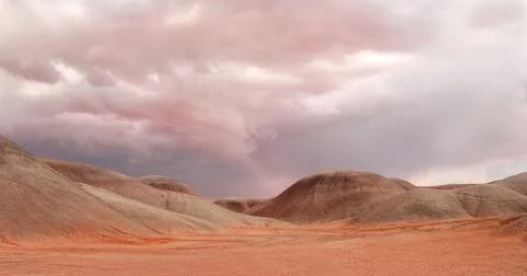 Sand dunes under a dramatic sky near monument valley Stock Photos
