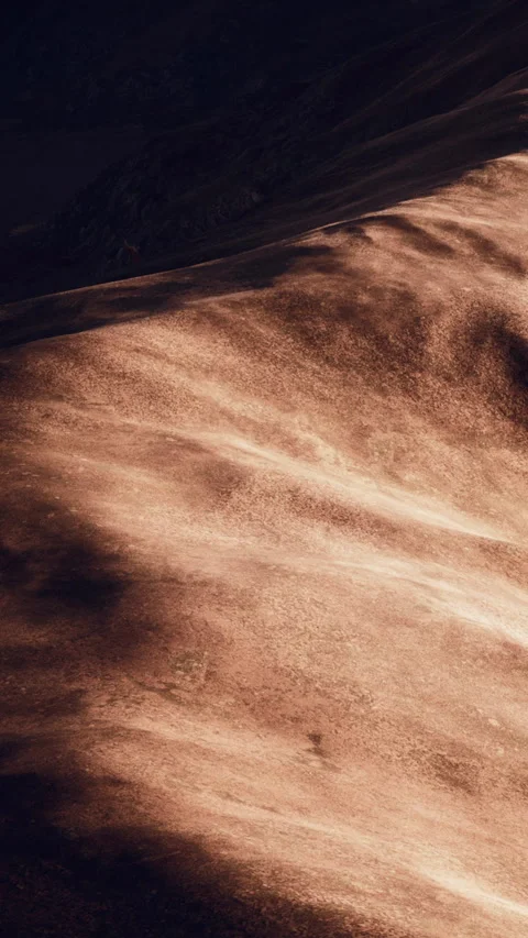 Sand dunes under sunlight create waves in texture at sunset Stock Footage 346678690