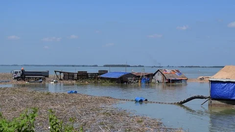 Sand exploit on river with floating house Stock Footage 90108293