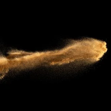 Sand explosion isolated on black background. Freeze motion of sandy dust. Foto stock