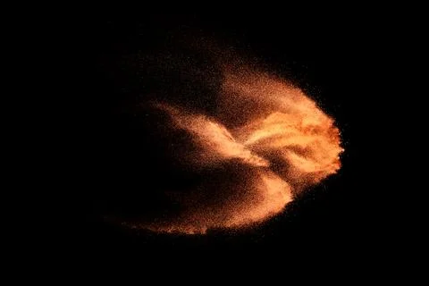 Sand explosion isolated on black background. Freeze motion of sandy dust. Foto stock