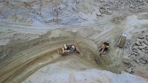 Sand extraction concept. Drone footage of moving dump truck full of sand. Shot Stock Footage 219951408