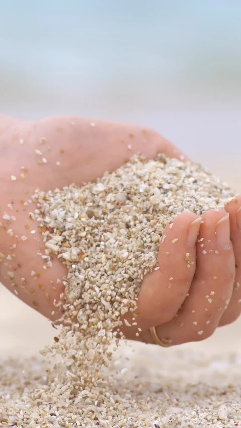 Sand falling from hand in slow motion on a beach. Vacation and travel conce.. Stock Footage 346393938