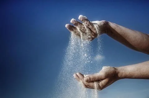 Sand falling from Hands Stock Photos