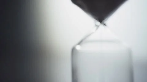 Sand falling from an hourglass with backlighting. Stock Footage 162649437