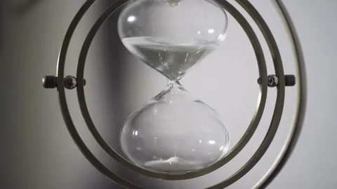 Sand falling from an hourglass with backlighting. Stock Footage 162649540