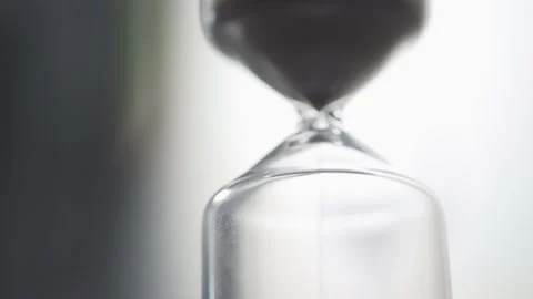Sand falling from an hourglass with backlighting. Stock Footage 162649788