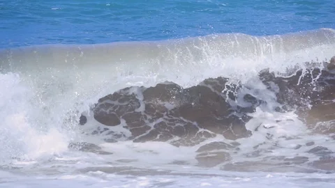 Sand filled wave crashing into itself in slow motion 250 fps Video stock 87703072