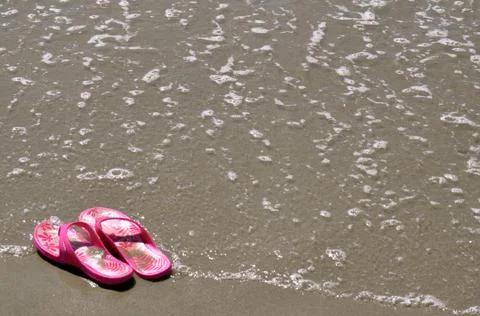 In the sand - flip-flops 17 Stock Photos