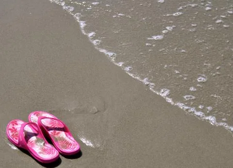 In the sand - flip-flops 19 Fotos Stock