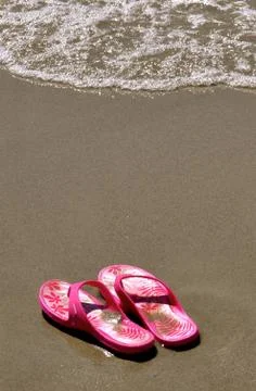 In the sand - flip-flops 9 Stock Photos