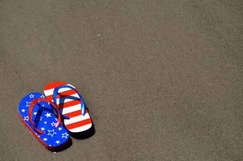 In the sand - flip flops Fotos Stock
