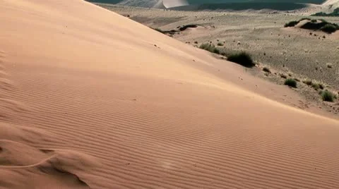 Sand floating over big daddy dune at soussuvlei,namibia,africa Stock Footage 22091379
