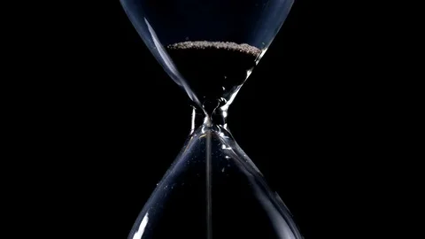 The sand flow in the hourglass until the end of time black background backlight Stock Footage 90068940