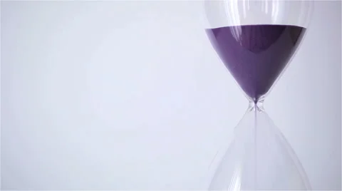Sand flowing through an hourglass Stock Footage 52072822
