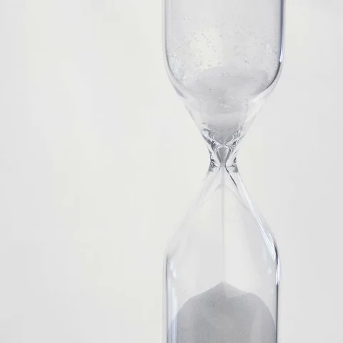 Sand flows through a hourglass Stock Footage 69487698