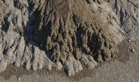 Sand forming patterns on beach from stream outlet. North Devon, England Stock Photos
