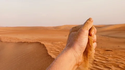 Sand Grains Falling Through Hand Stock Footage 123911819
