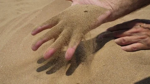 Sand in the hands of men. Slow motion. Stock Footage 77155928