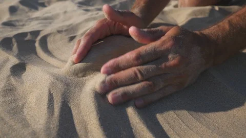 Sand in the hands of men. Slow motion. Stock Footage 115903735