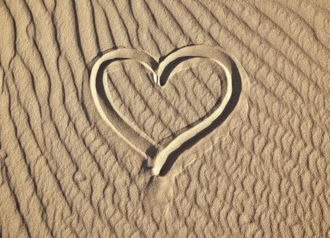 Sand heart Stock Photos