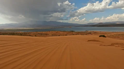 Sand Hollow Lake Utah red sand dunes off... | Stock Video | Pond5