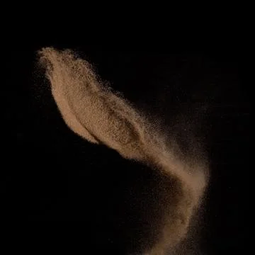 Sand, isolated on black background. Stock Photos