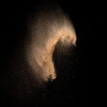Sand, isolated on black background. Stock Photos