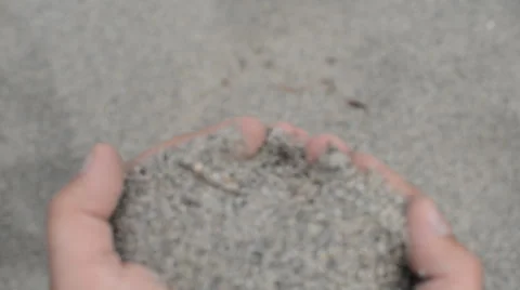 Sand leaking through fingers Stockbeeldmateriaal 44239977