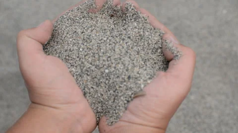 Sand in male hands leaking through fingers Stockbeeldmateriaal 44239993
