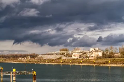 Sand mining on the rhine. Stock Photos