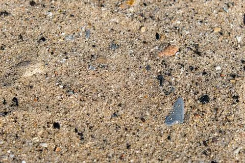 Sand mixed with pebbles background Stock Photos