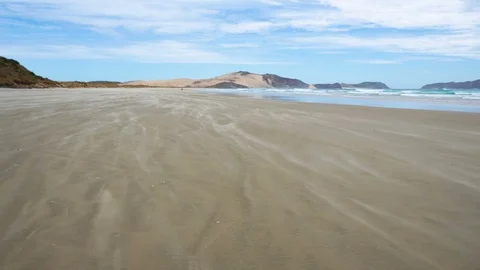 Sand is moving in a wind in ocean beach coast Stock Footage 103164589