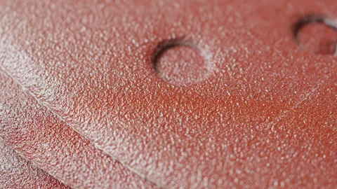 Sand paper surface macro close up presentation slowly rotating stock footage Stock Footage 344705881