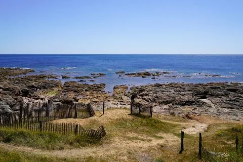 Sand pathway coast access rocks beach entrance to ocean atlantic sea in bri.. Stock Photos