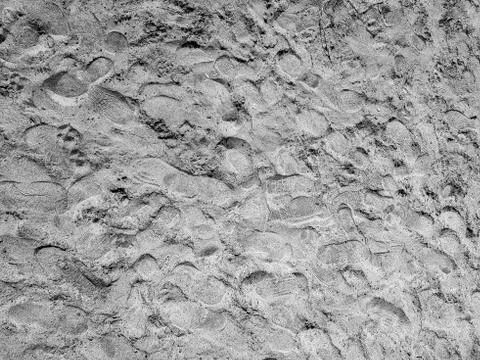 Sand pattern background with foot steps impression Stock Photos