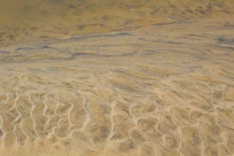 Sand pattern on the beach Stock Photos