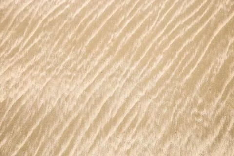 Sand pattern on the beach Stock Photos