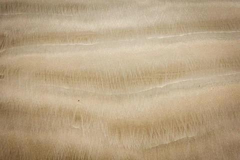 Sand pattern showing wave formation created as water washed away on falling.. Stock Photos