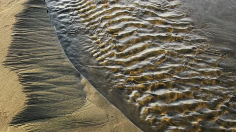 Sand patterns and small stream, Bandon, Oregon Coast Video stock 170203839