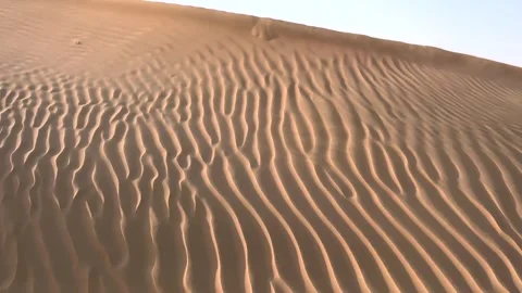 Sand patterns become more defined as evening light fades, casting soft shadows Stock Footage 284830044