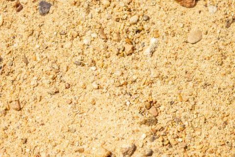 Sand with pebbles. Stock Photos