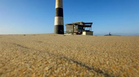 Sand peninsula with old lighthouse in Namibia, southern Africa Fotos de archivo
