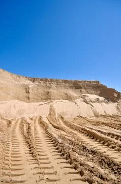 Sand pit with traces of tractor Stock Photos