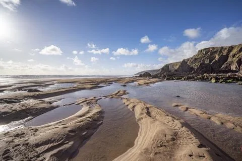 Sand pools shape by the outgoing tide in Cornwall Stock-Fotos
