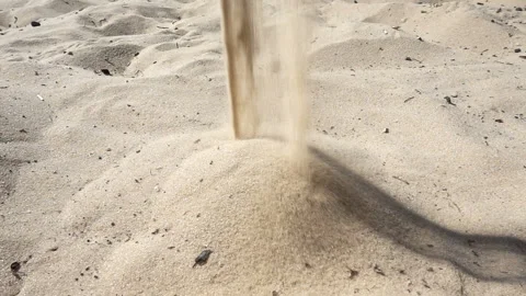 Sand is poured in slow motion Stock Footage 159658448